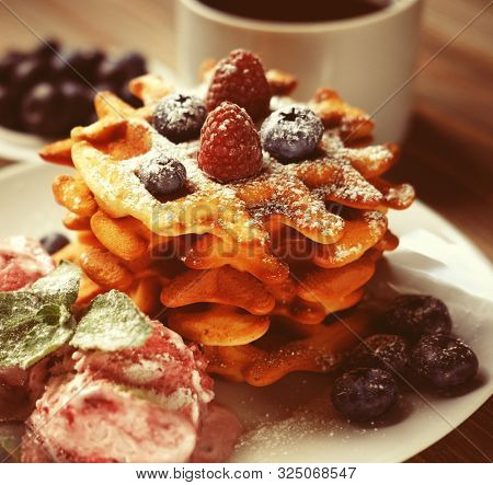 Belgian waffles with fresh berries and ice cream 