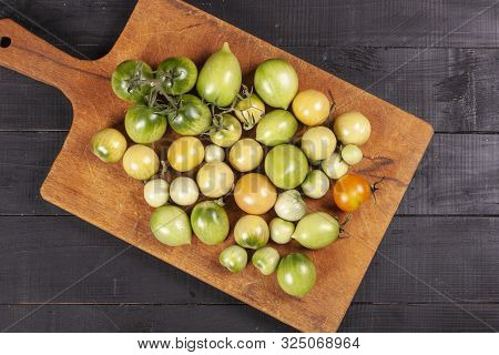 Green Fresh Tomato On A Wooden Kitchen Board, Vegetarian Food, Healthy Nutrition, Fresh Tomatoes