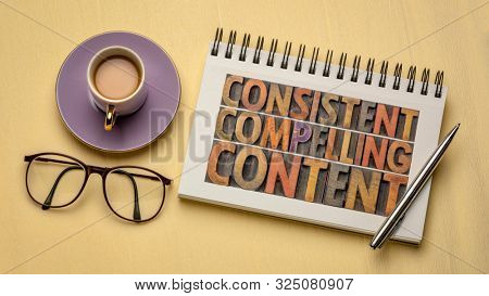 consistent, compelling content -  recommendation for creativity, bloging and social media marketing - a word abstract in vintage letterpress wood type in a notebook, flat lay with coffee and glasses