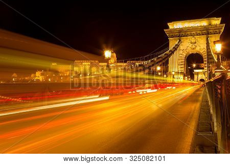 The Famous Széchenyi Chain Bridge In Budapest With The Buda Castle At A Background, Hungary. Long Ex