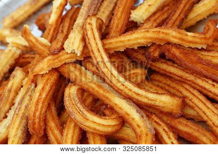 Close Up Tray Of Sweet Fresh Churros, Traditional Spanish Or Portuguese Deep Fried Dough Pastry Snac