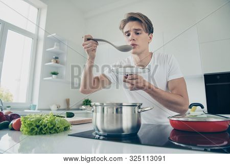 Portrait Of His He Nice Attractive Cute Puzzled Focused Guy Making Dinner Lunch Luncheon Boiling Sou