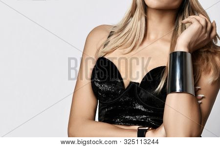 Closeup Of Beautiful Young Touching Blonde Hair Woman Top In Velvet Bralet, Bared Shoulders And Wris