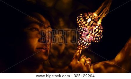 Magic Hot Light From Lanterns Falls On The Woman Eyes. The Naked Adult Sexy Caucasian Girl Lies At N