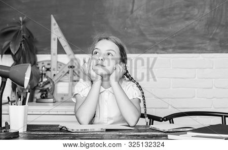 Thoughtful Child. Small Child In Classroom. Digital Age With Modern Technology. Small Girl Study Wit