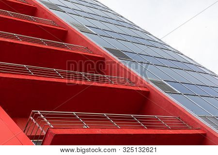 High Modern Building Facade With Terracotta, Bright Orange Parget Wall, Balcony And Glass Windows, D
