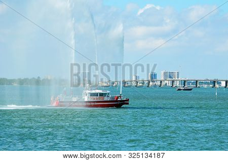 Miami Beach,florida,u.s.a. 27 September 2019. City Of Miami Fire Rescue Boat Spraying Water Canons I