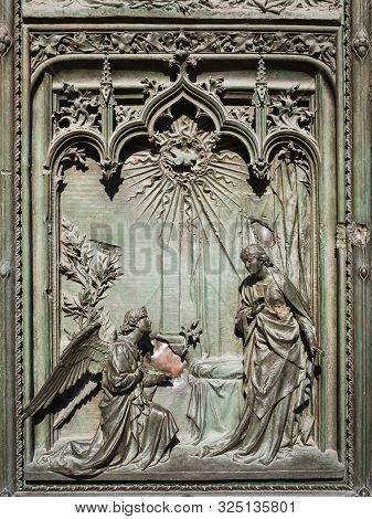 Ornate Detail Of The Bronze Door Of Milan Catehdral In Italy