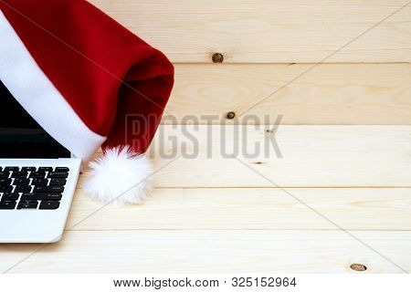 Laptop With Blank Screen And Santa Slaus Hat