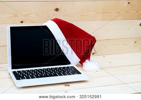 Laptop With Blank Screen And Santa Slaus Hat