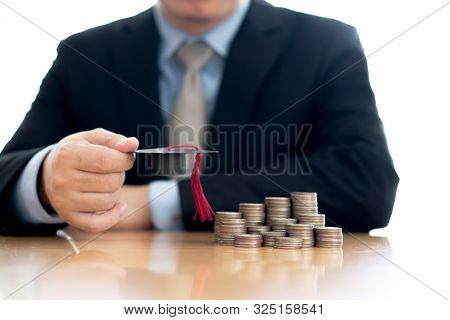 Businessman Saveing Coins For Eudcation, University  Concept