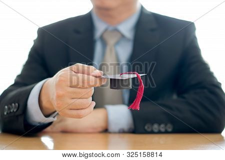 A Businessman Hold Cap Eudcation Concept University.