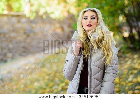 Oversized Jacket Trend. How To Rock Puffer Jacket Like Star. Girl Fashionable Blonde Walk In Autumn 