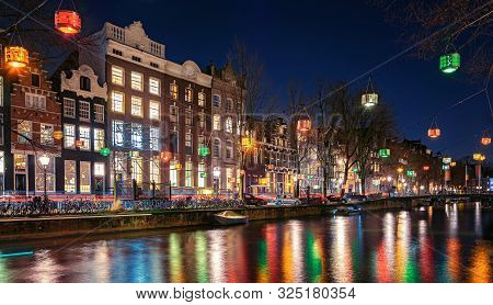 Amsterdam, Netherlands - January 14, 2019: Light Festival Amsterdam,  Colorful Lanterns Above The He