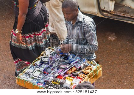 Kampala, Uganda - October 03, 2012.  A Man Sells Cell Phone Cases At The Taxi Park In Kampala, Ugand