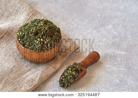 Mixed Spice Zaatar Or Zatar In Wooden Bowl On Stone Background