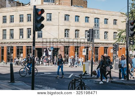 London, Uk - September 07, 2019: People Crossing The Road In Front Of Allsaints Shop In Shoreditch, 