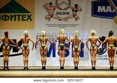 MOSCOW - APRIL 16: Women-participants stand with their backs to the audience at the Open Championship and Cup of Moscow of bodybuilding, fitness, bodyfitness, April 16, 2011, Moscow, Russia.