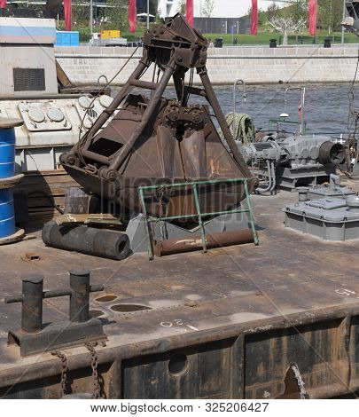 Closeup Of An Old Rusty Clamshell Bucket From Wire Ropes And Chains