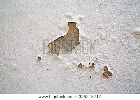 Dirty Cracked White Wall Paint Peeling Off. House Problem With Color Paint Wall Is Peeling Off. Conc