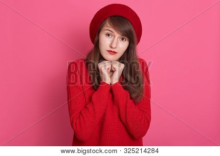 Image Of Caucasian Darkhaired Modest Woman Wearing Red Beret And Sweater, Model Posing Isolated Over