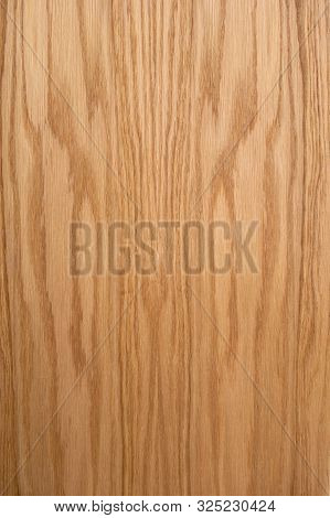 Oak Plank. The Structure Of Natural Oak. A Tangential Cut Of A Tree Trunk. Brown Natural Background.