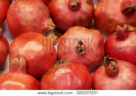 Photo Of Big Red Granades. In Market