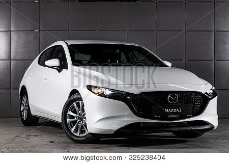 Novosibirsk, Russia - September 30, 2019:  White Mazda 3, Front View.  Photography Of A Modern Hatch