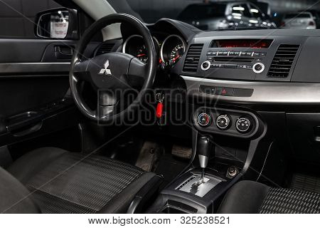 Novosibirsk, Russia - September 07, 2019:  Mitsubishi  Lanser, Black Luxury Car Interior - Steering 