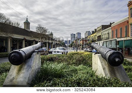 New Orleans, Usa - Dec 17, 2017: Two Antique Cannons Pointing Out Towards Decatur Street In The Fren
