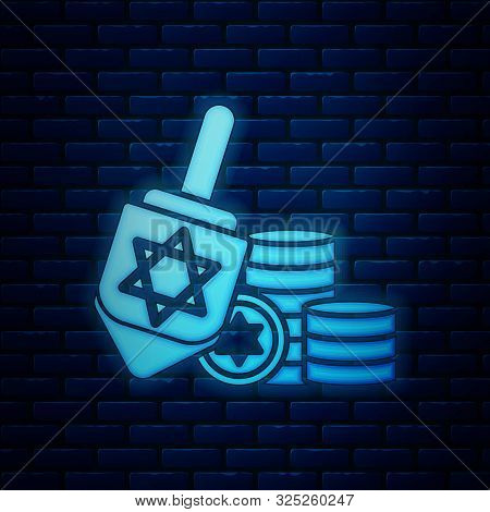 Glowing Neon Hanukkah Dreidel And Coin Icon Isolated On Brick Wall Background. Vector Illustration