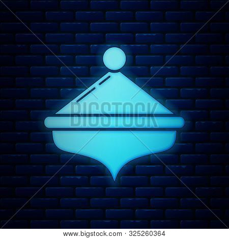 Glowing Neon Hanukkah Dreidel Icon Isolated On Brick Wall Background. Vector Illustration