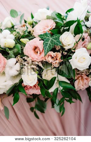 Variety Of Greens And Flowers In The Wedding Bouquet On The Table Of Newlyweds.