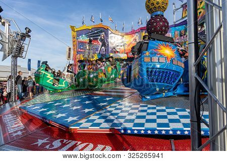 Munich, Germany, 2019 September 28: Visitors Enjoy On An Amusement Park Ride. Breakdancer Fun Ride, 