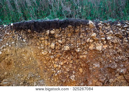 The Curb Erosion From Storms. To Indicate The Layers Of Soil And Rock. Nature Cross Section Soil Und
