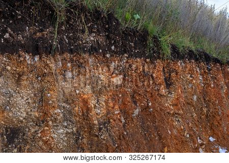 The Curb Erosion From Storms. To Indicate The Layers Of Soil And Rock. Nature Cross Section Soil Und