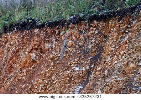 The Curb Erosion From Storms. To Indicate The Layers Of Soil And Rock. Nature Cross Section Soil Und