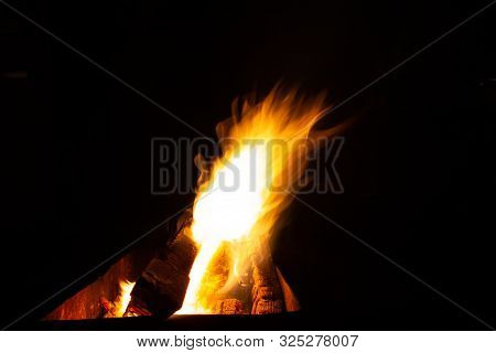 The Fire Burns In The Grill At Night. Bright Fire, Wood. The Flames On The Night