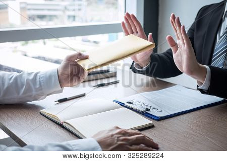 Anti Bribery And Corruption Concept, Business Man Refusing And Don't Receive Money Banknote In Envel