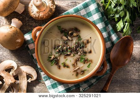 Homemade Mushroom Soup In Bowl On Wooden Table.top View