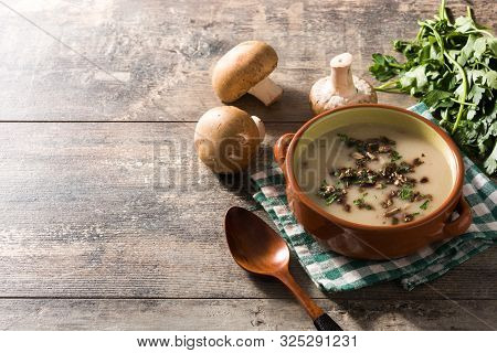 Homemade Mushroom Soup In Bowl On Wooden Table.copy Space