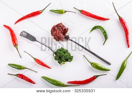 Hot Chili Pepper Paste. Red And Green Sauce On White Background. Adjika Or Ajika In Georgian Cuisine