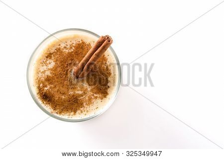 Homemade Eggnog With Cinnamon In Glass Isolated On White Background. Typical Christmas Dessert. Top 