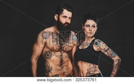Young Attractive Man Couple Is Posing For Photographer At Photo Studio.