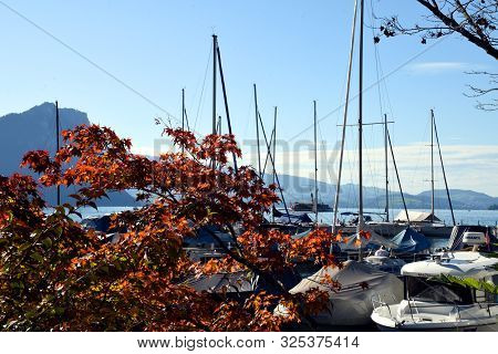 Vitznau, Switzerland 29.09.2019: Sailing Boats Resting In The Port Of Vitznau On Lake Lucerne With V
