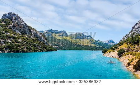 Embassament De Cuber Is An Artificial Turquoise Colour Lake, Water Reservoir, Located At The Valleys