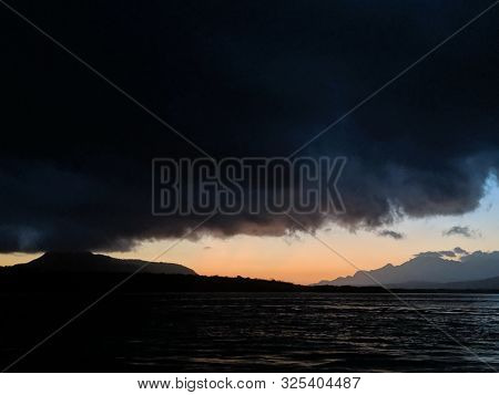 Jembrana, Bali, Indonesia - August 20, 2019: Background Of Bali Island In The Dawn As Viewed From Gi