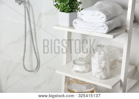 Shelving Unit With Cotton Balls, Swabs And Pads In Bathroom