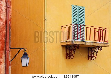 Yellow wals and red coloured balcony