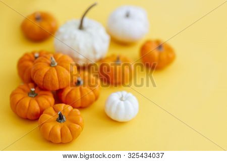 Halloweeen Theme With A Pumpkins On A Yellow Background